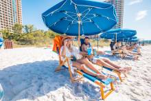 Couple relaxing in a beach chair on Adventure Cove.