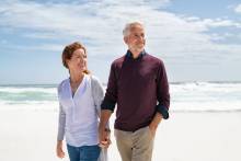 Snowbird Couple walking on Pensacola Beach