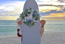 Santa taking a photo on the beach