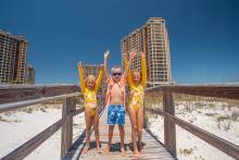 Kids excited on the Portofino Boardwalk on Pensacola Beach