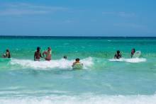 Teens playing on the beach
